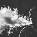 grayscale photography of smoking man