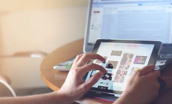 person holding black iPad